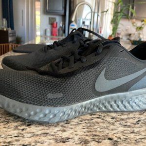 Black Nike Revolution running shoe